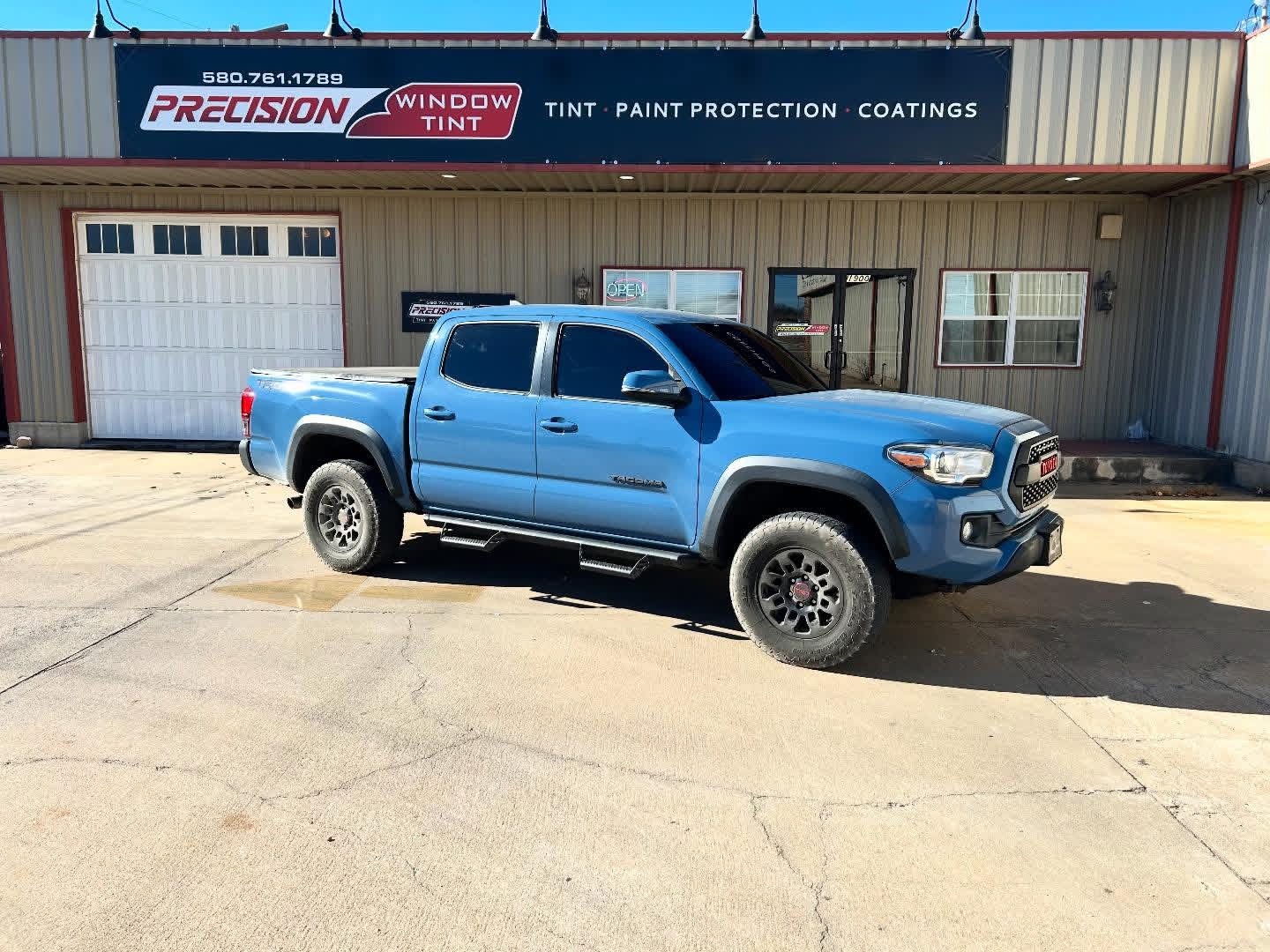Cavalry Blue Toyota Tacoma TRD with dark window tint Ponca City