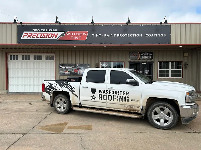 Precision Window Tint shop front with Warfighter Roofing truck — locally trusted Ponca City business